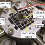 Vibration and tracking control of a flexure-guided nanopositioner using a piezoelectric strain sensor (Invited Paper)